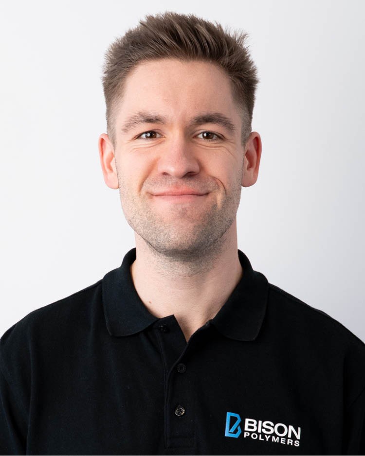 Andreas Zimmer wearing a black polo shirt with the BISON Polymers logo