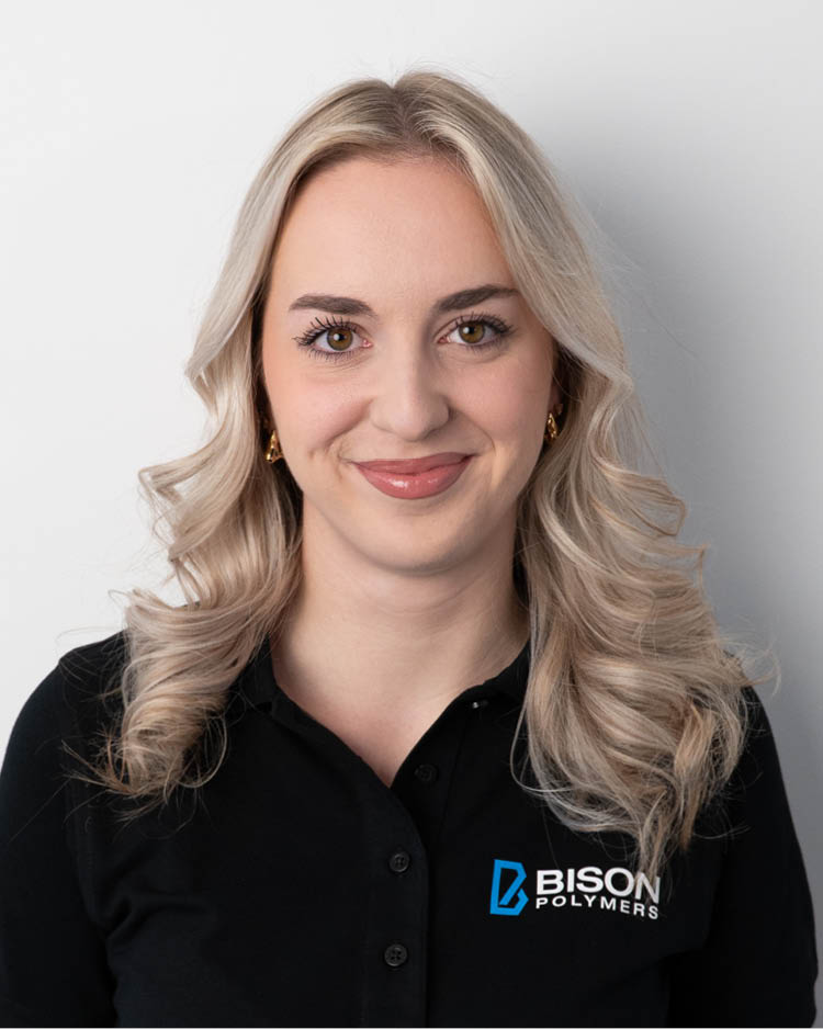 Arlinda Alshiqi wearing a black polo shirt with the BISON Polymers logo