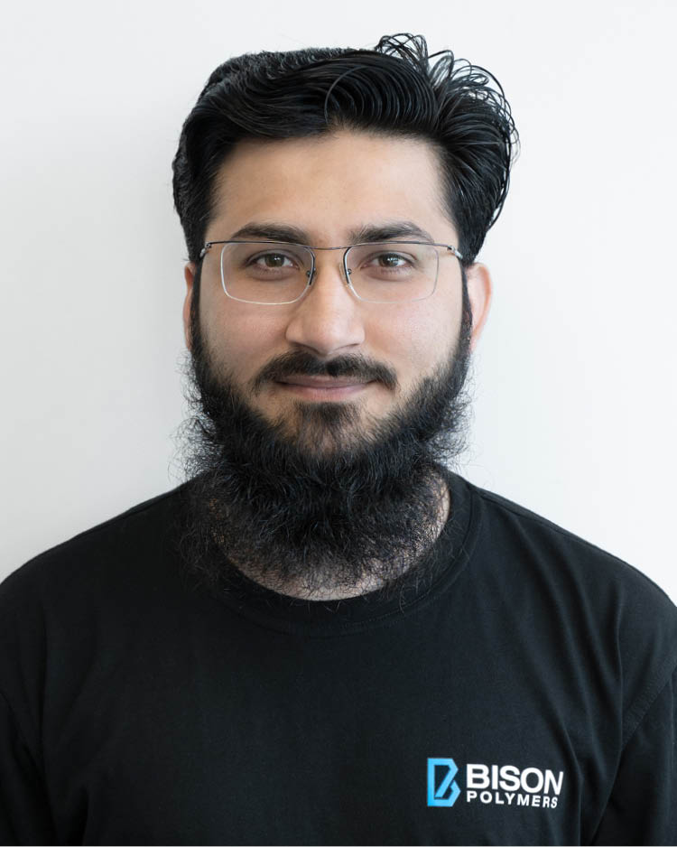 Asad Ali Khan wearing a black T-shirt with the BISON Polymers logo