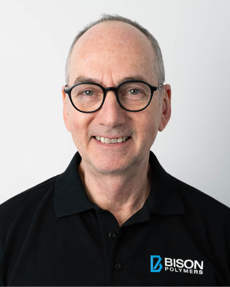 Christoph Hagspihl wearing a black polo shirt with the BISON Polymers logo