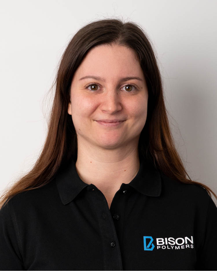 Joalene Schmitt wearing a black polo shirt with the BISON Polymers logo
