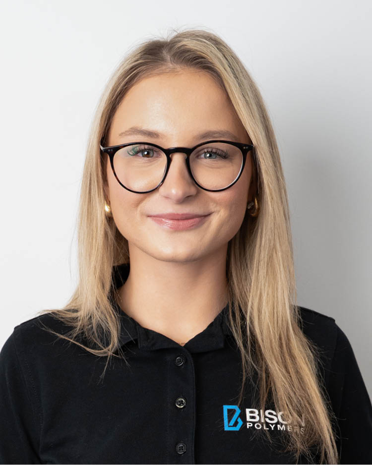 Lisa Menzel wearing a black polo shirt with the BISON Polymers logo