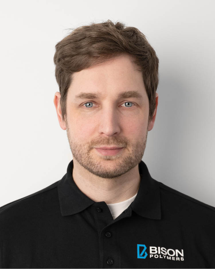 Marian Schiemann wearing a black polo shirt with the BISON Polymers logo