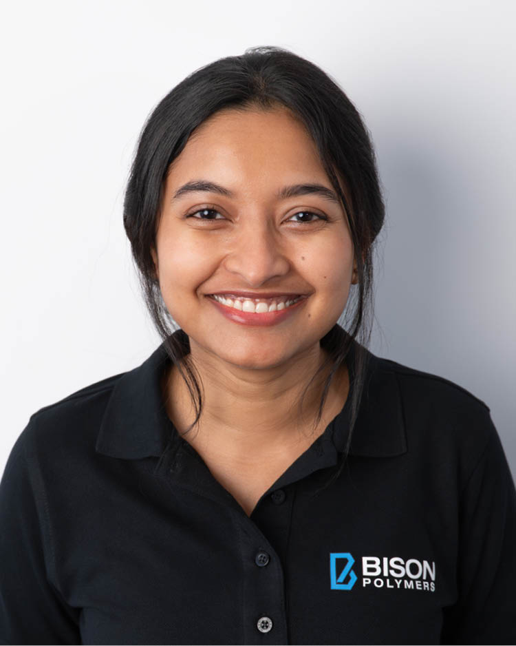 Nusrat Munzarin Methila wearing a black polo shirt with the BISON Polymers logo